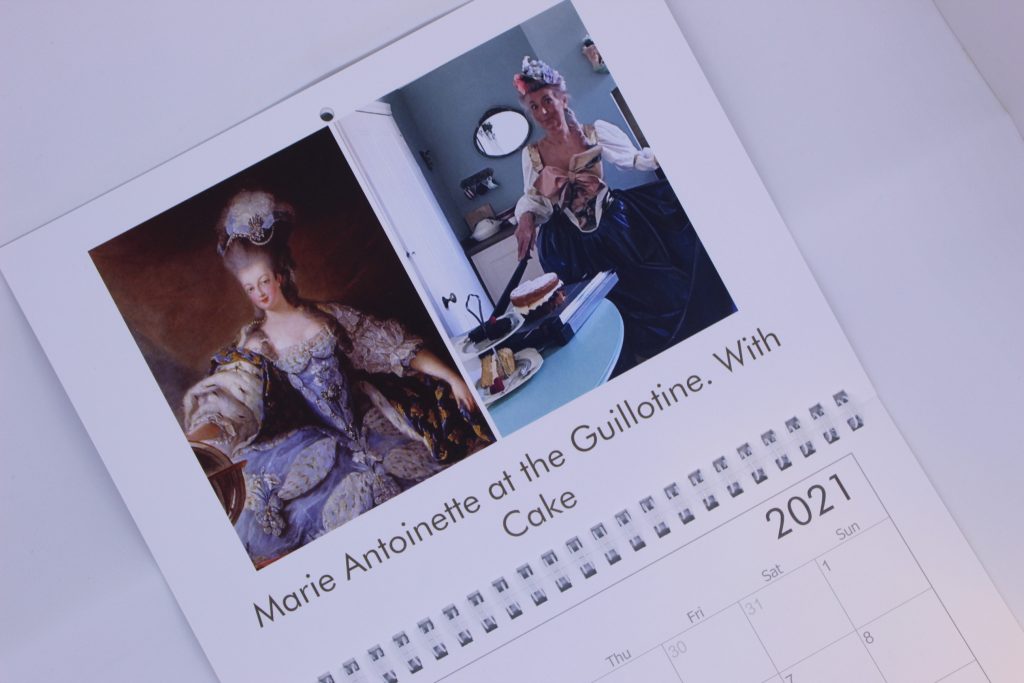 STOPM_2020_545d:  close-up view of a month in Valerie's Gallery calendar - the image on the left is a painting of Marie Antoinette, on the right is Valerie's version: wearing a costume dress and cutting a cake. Text says 'Marie Antoinette at the Guillotine, With Cake'.